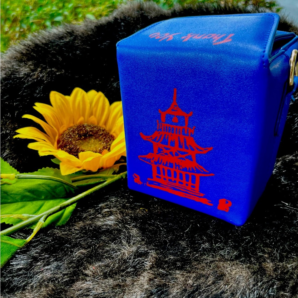 Unused blue 5x4 square clutch with, red Chinese graphics.